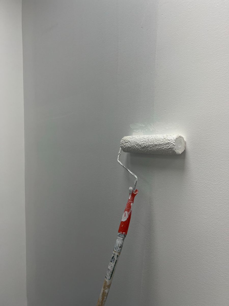 Interior wall being painted with a roller